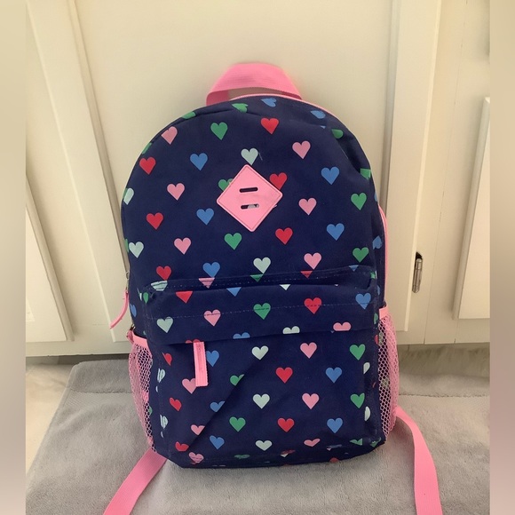 Protege colorful hearts on blue background backpack with pink accents. - Picture 2 of 7
